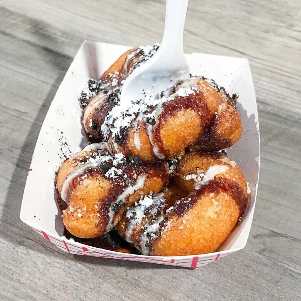 glazed and confused mini donuts in a tray