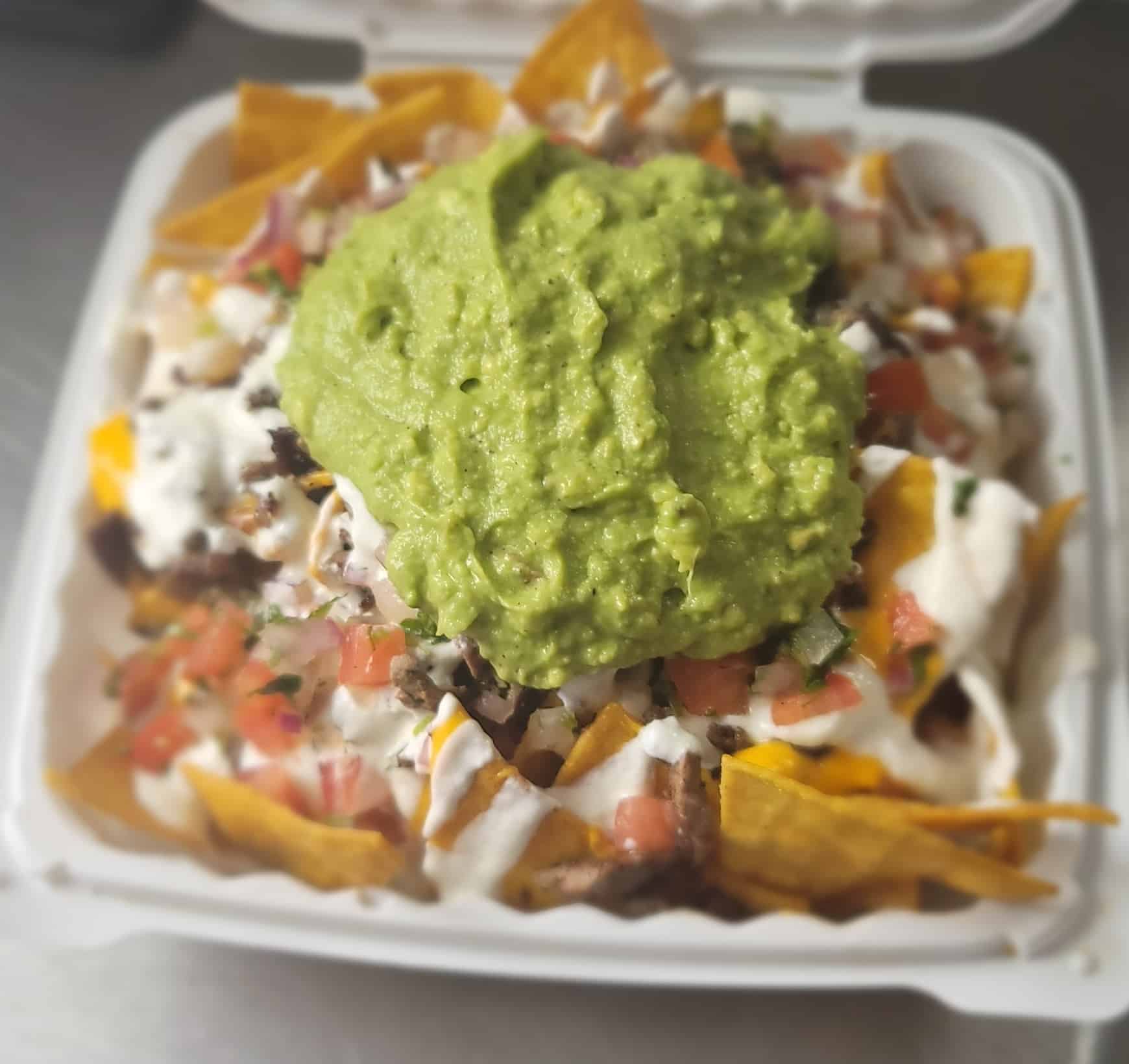 Nachos topped with Guacamole