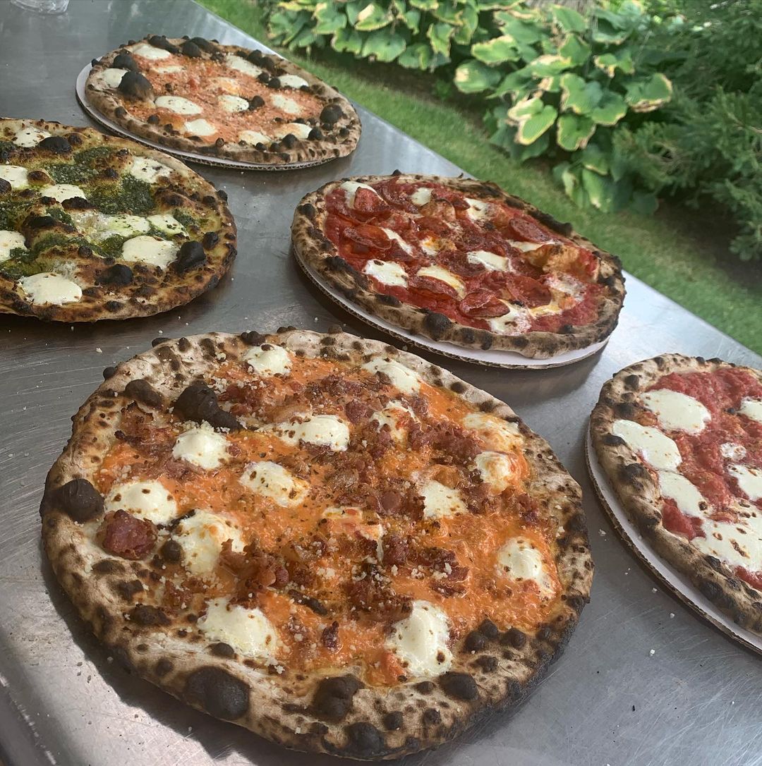 Variety of pizzas from Pie Oh My food truck.