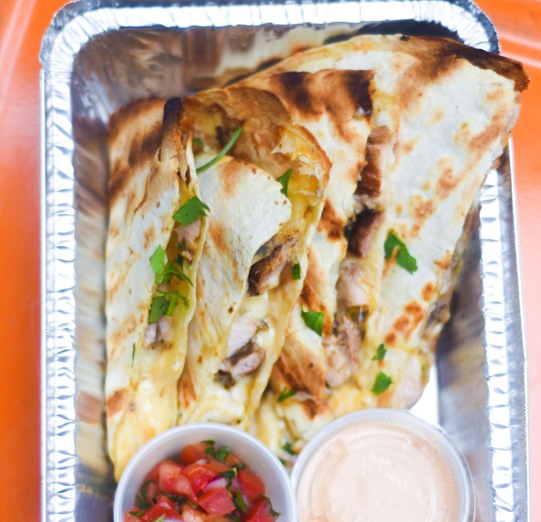 Chicken Quesadilla with side of salsa from Chop Shop Food Truck