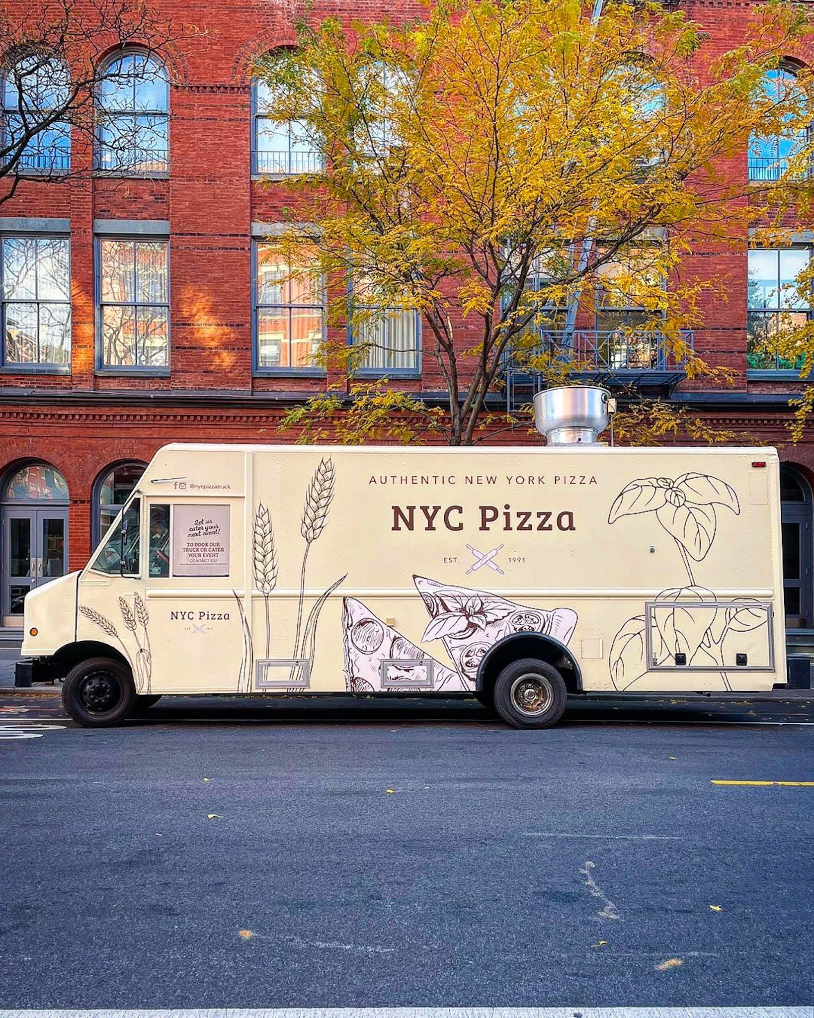 nyc pizza truck in front of red brick in new york