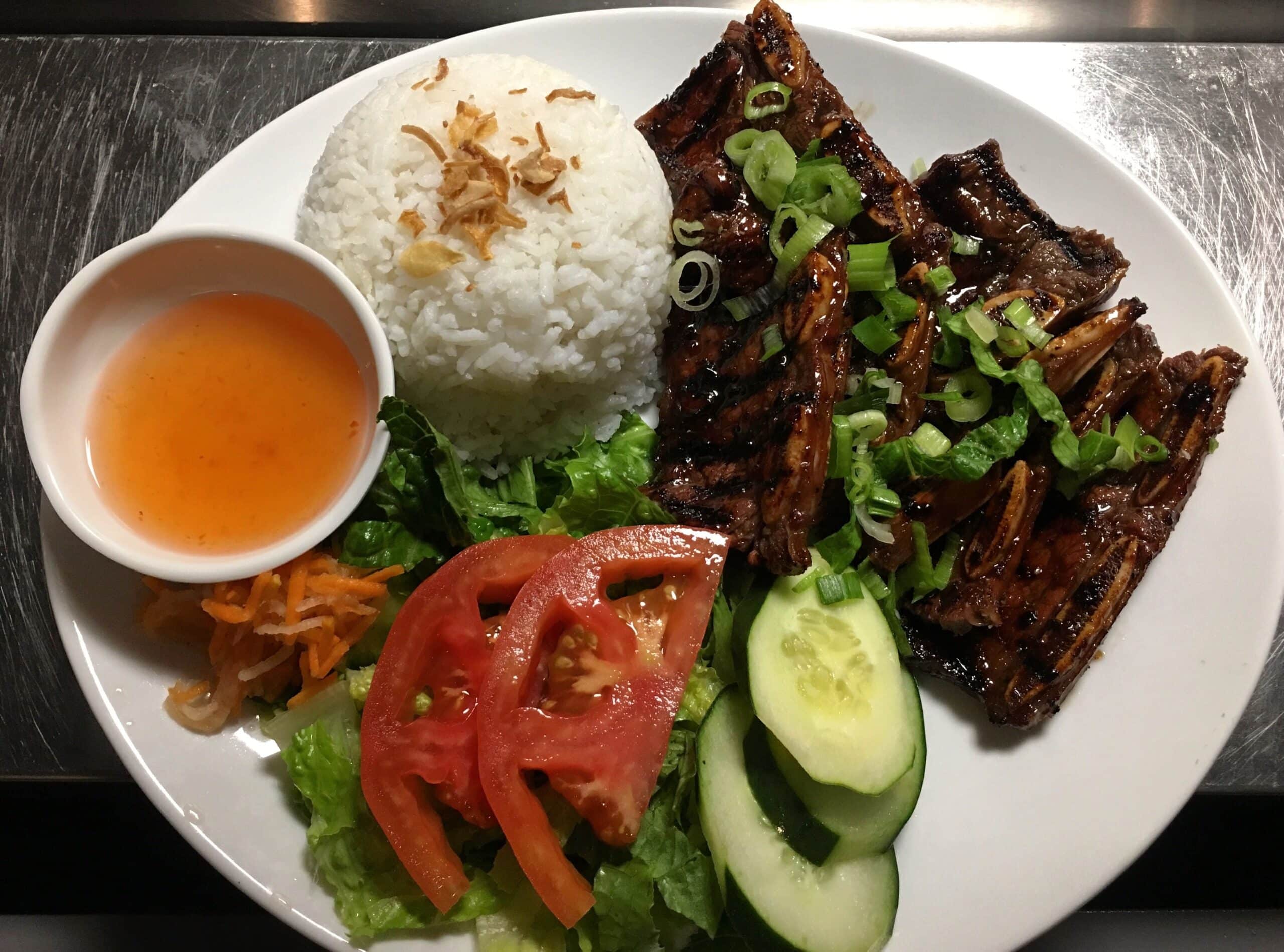 Grilled baby ribs, rice, and salad