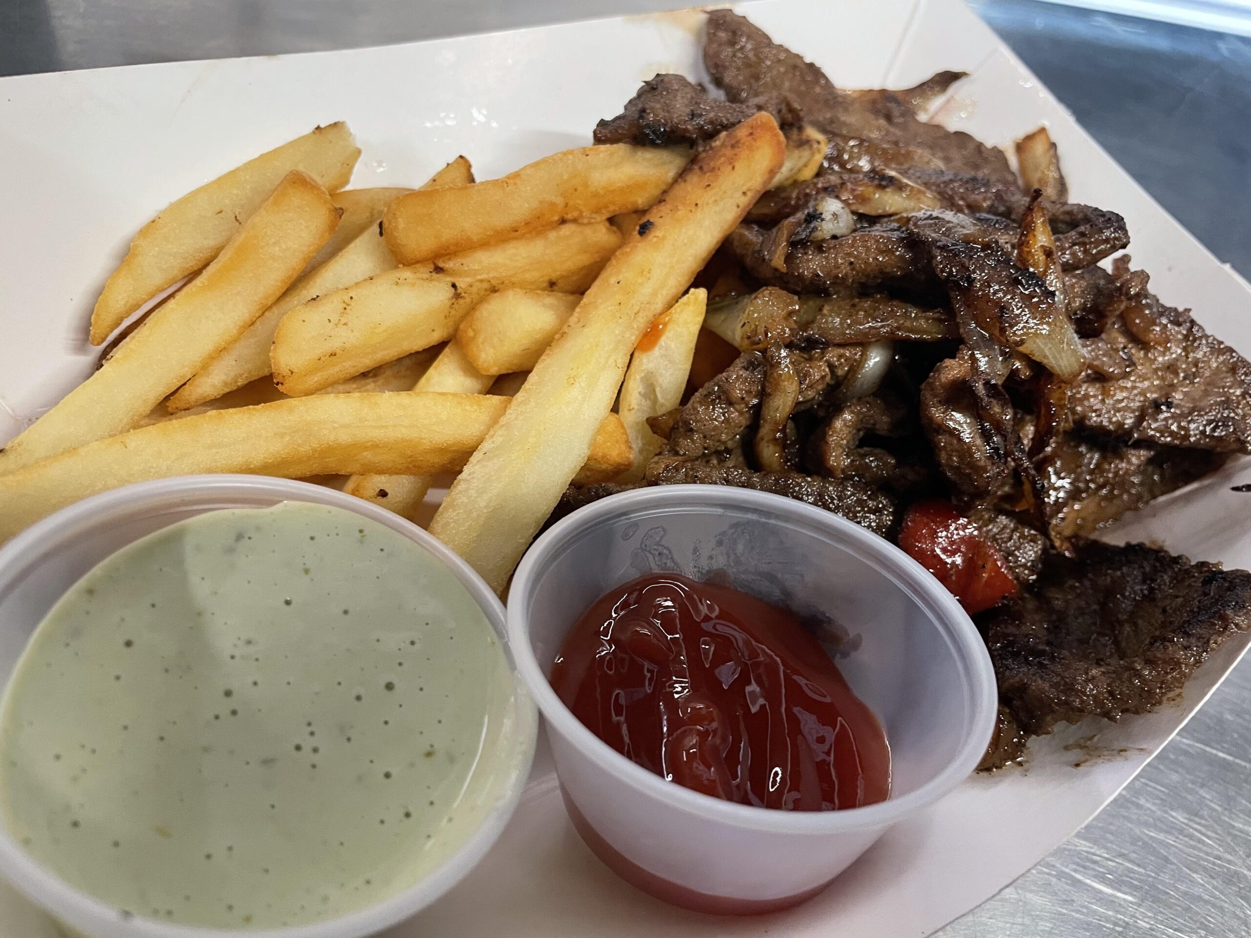 Grilled steak and french fries from Venezuelan food truck Caripito's