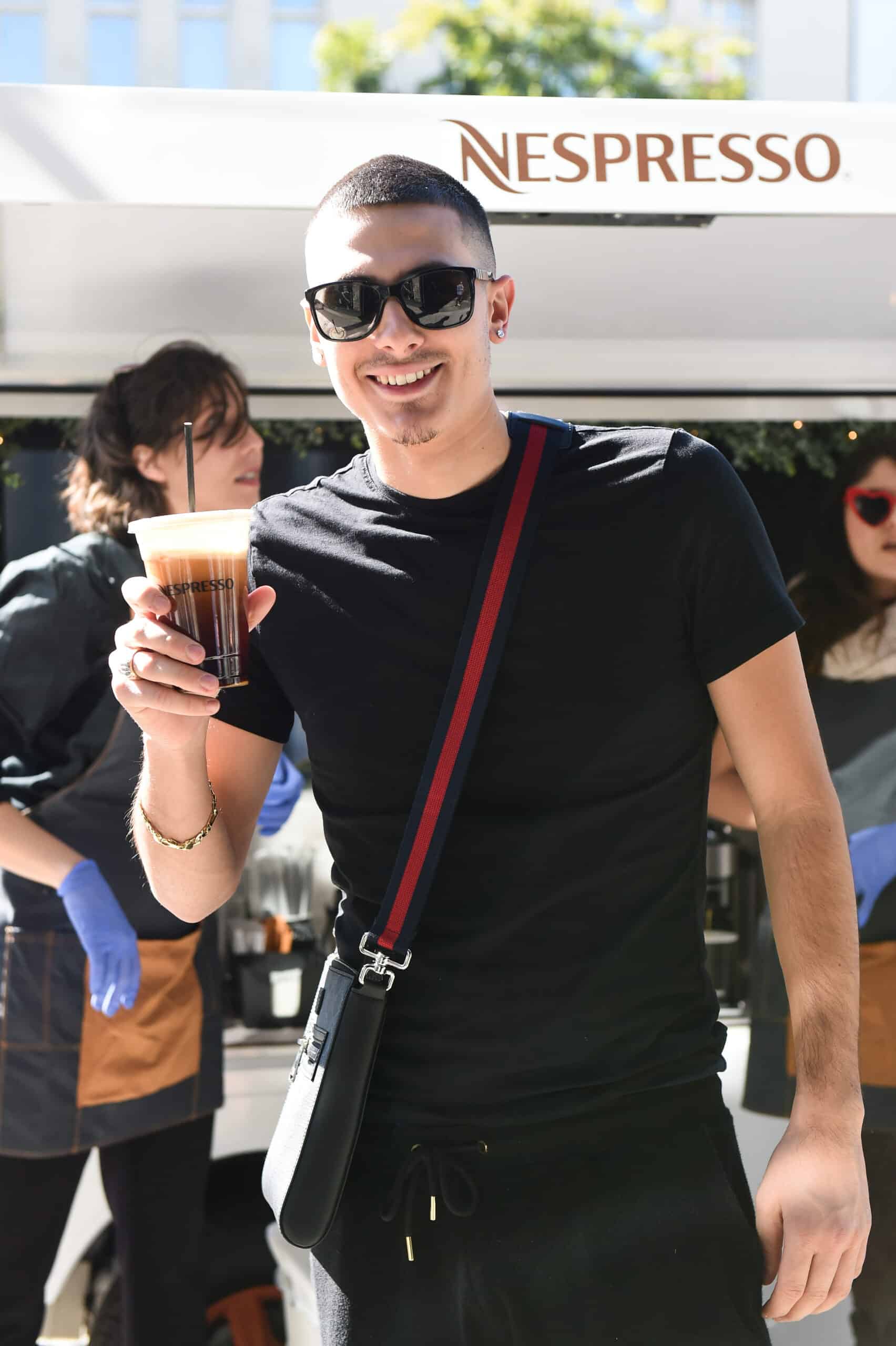 Man Holding Iced Nespresso Coffee