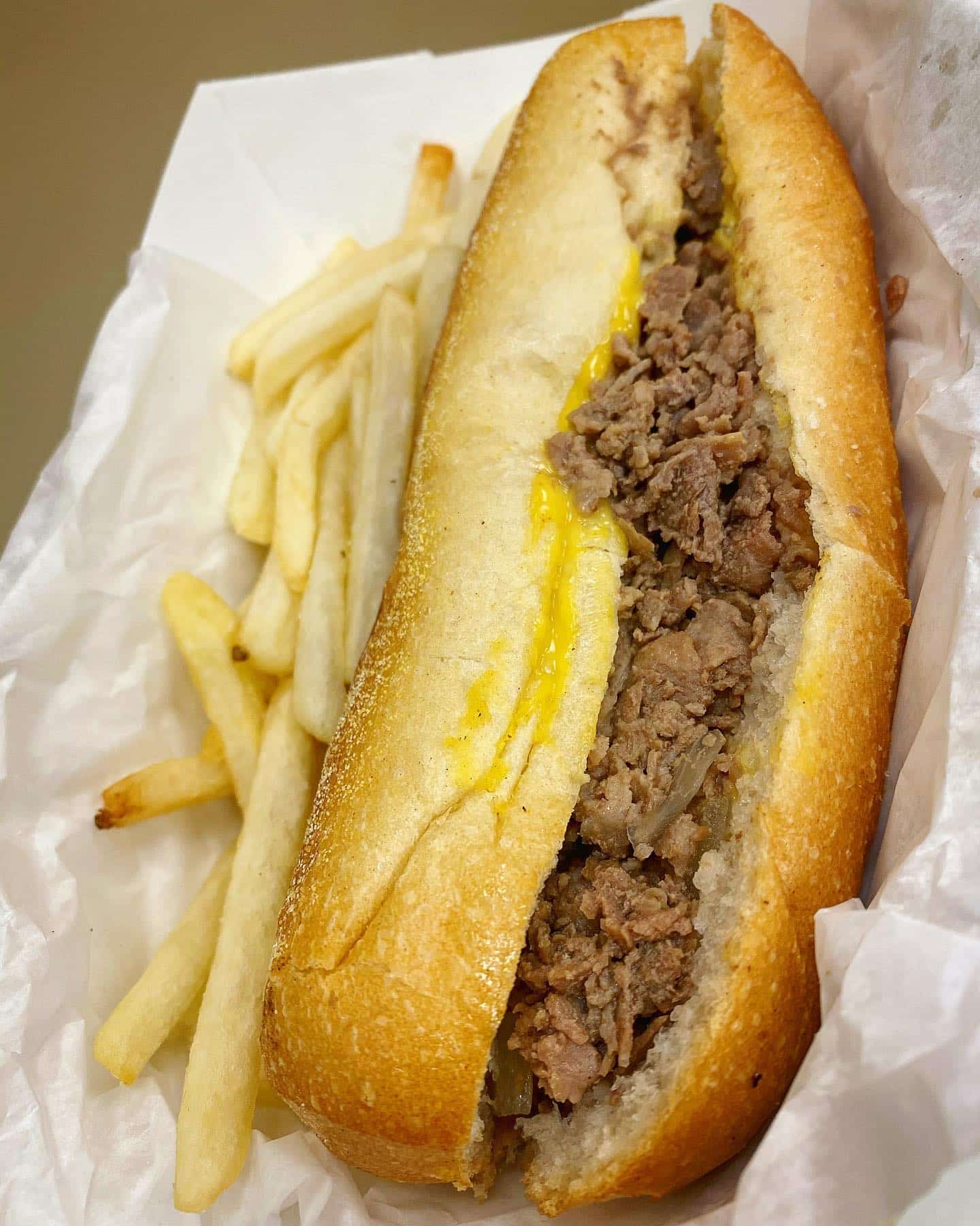 Philly Cheesesteak with Wiz and fries