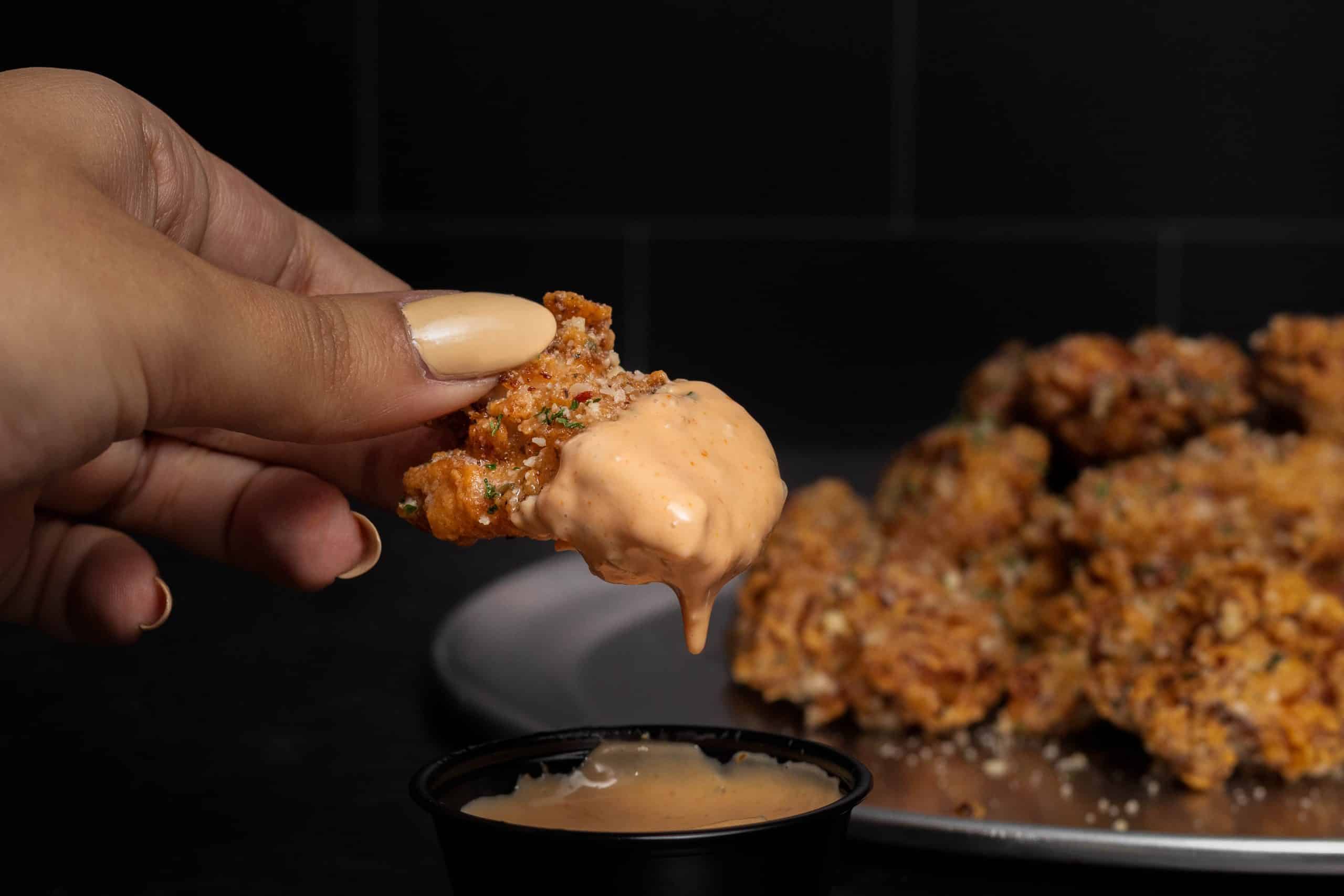 Fried chicken thigh nuggets, garlic butter and your choice of dipping sauce.
