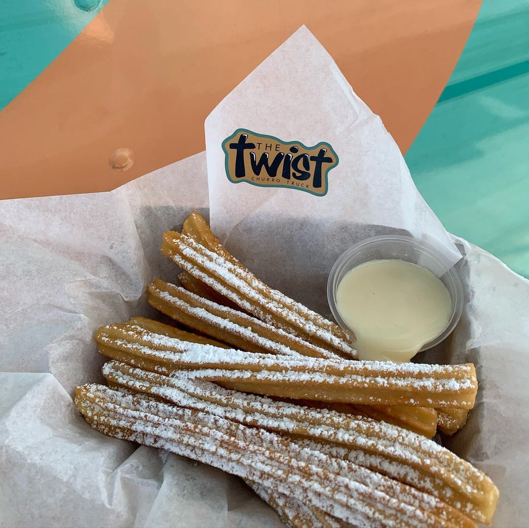 The Twist Churros with a side of dipping sauce
